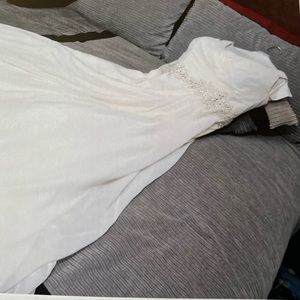 Size 14 off white A-Line cut Wedding Dress. Worn once in 2014 then preserved.